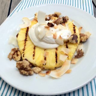 grilled pineapple with cream, coconut, & walnuts - this is a fresh, tasty summer dessert that is festive enough for entertaining but if you have an avid griller in the family it would also make a really festive weekend breakfast!