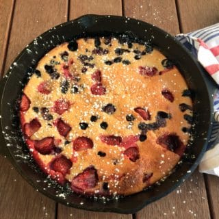This amazingly simple berry clafoutis is not only delicious but also healthy! Made with whole wheat flour, almond flour, it is also dairy-free and lower in sugar than a traditional clafloutis. It is a bit of a Dutch Baby - Clafoutis hybrid, and it's healthful properties make it a perfect way to start or end your day! It's so easy to make: just combine ingredients in a blender, pour into a heated and greased 10-inch cast-iron pan, and start checking for doneness at 18 minutes. Enjoy!