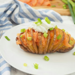 #ad This smoked salmon stuffed Hasselback potato is delicious any time of day--brunch, lunch or dinner! It's nutrient composition of complex carbs, protein, and potassium also makes it ideal for refueling after a workout. Give this nordic-inspired potato a try today! #gluten-free