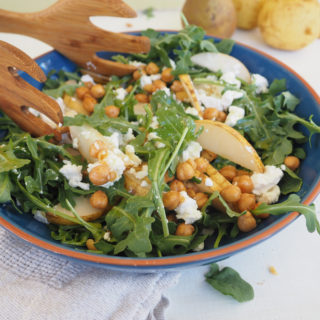 This arugula, pear, and roasted chickpea salad is as well suited for the weeknight dinner table as it is for the holiday buffet. The optional goat cheese adds a creamy texture that pairs perfectly with the pears. Roasted chickpeas add a fun, salty crunch and the apple cider and maple vinaigrette pulls it all together. Vegetarian. Gluten-free.