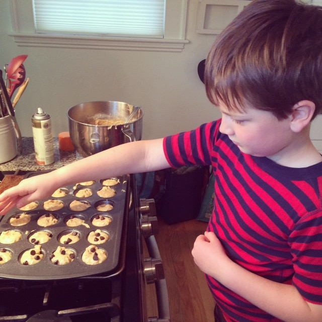 child making banana bread mini muffins