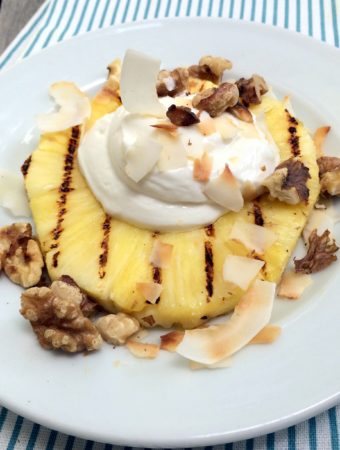 grilled pineapple with cream, coconut, & walnuts - this is a fresh, tasty summer dessert that is festive enough for entertaining but if you have an avid griller in the family it would also make a really festive weekend breakfast!
