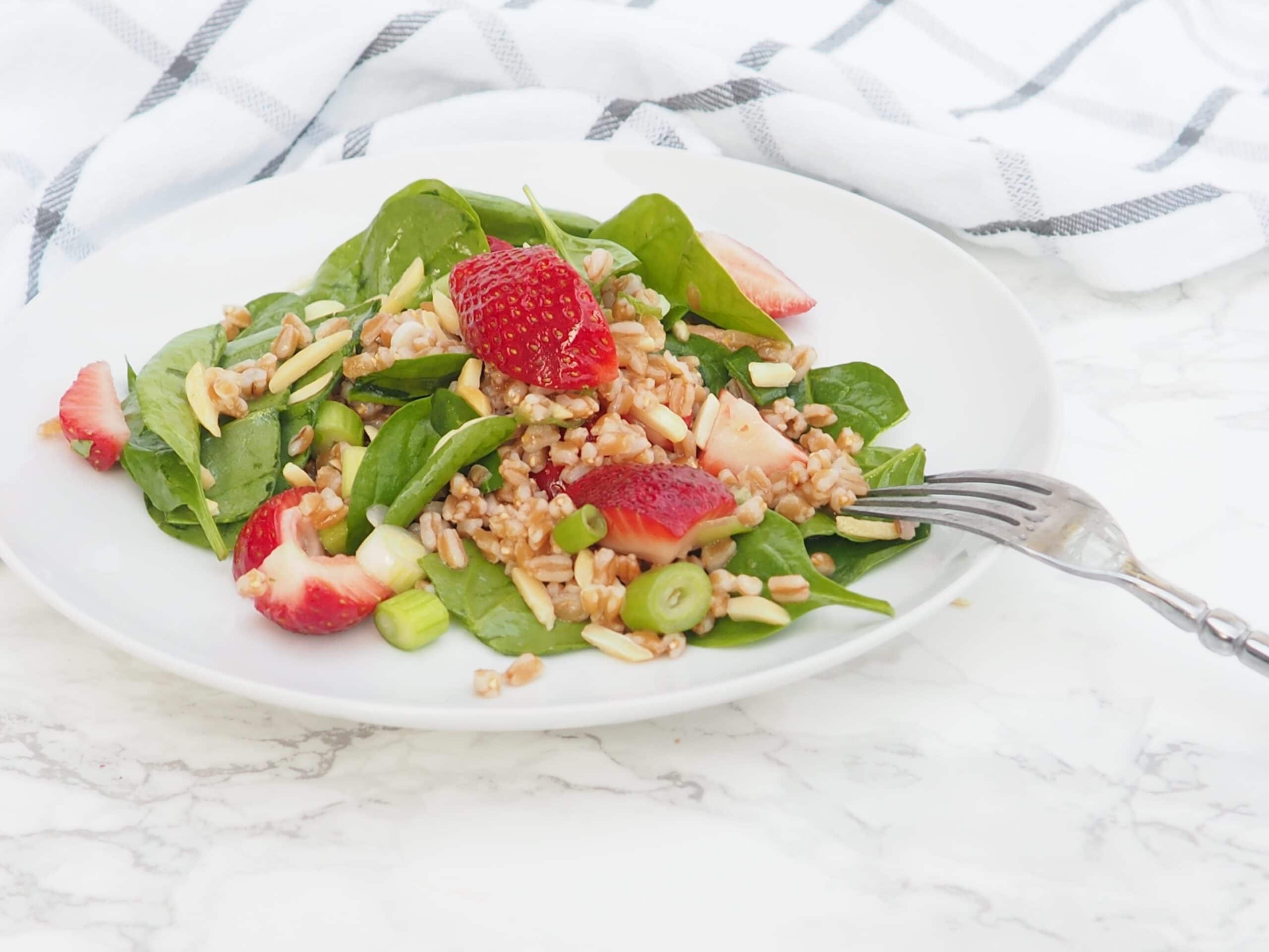 This strawberry, spinach, and farro salad is perfect for showcasing juicy, ripe strawberries. Farro is an ancient whole wheat grain that packs in 7 grams of fiber and protein per serving! A perfect side salad for your weeknight dinner or potluck salad at your next cookout. The strawberries will help entice young eaters to try the salad too!