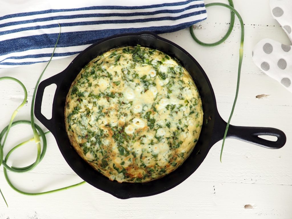 This kale and garlic scape frittata makes a delicious healthy meal. It's perfect for using up that leftover kale and a good way to use some of those fun garlic scapes that abound in late June. Gluten-free & vegetarian. halsanutrition.com