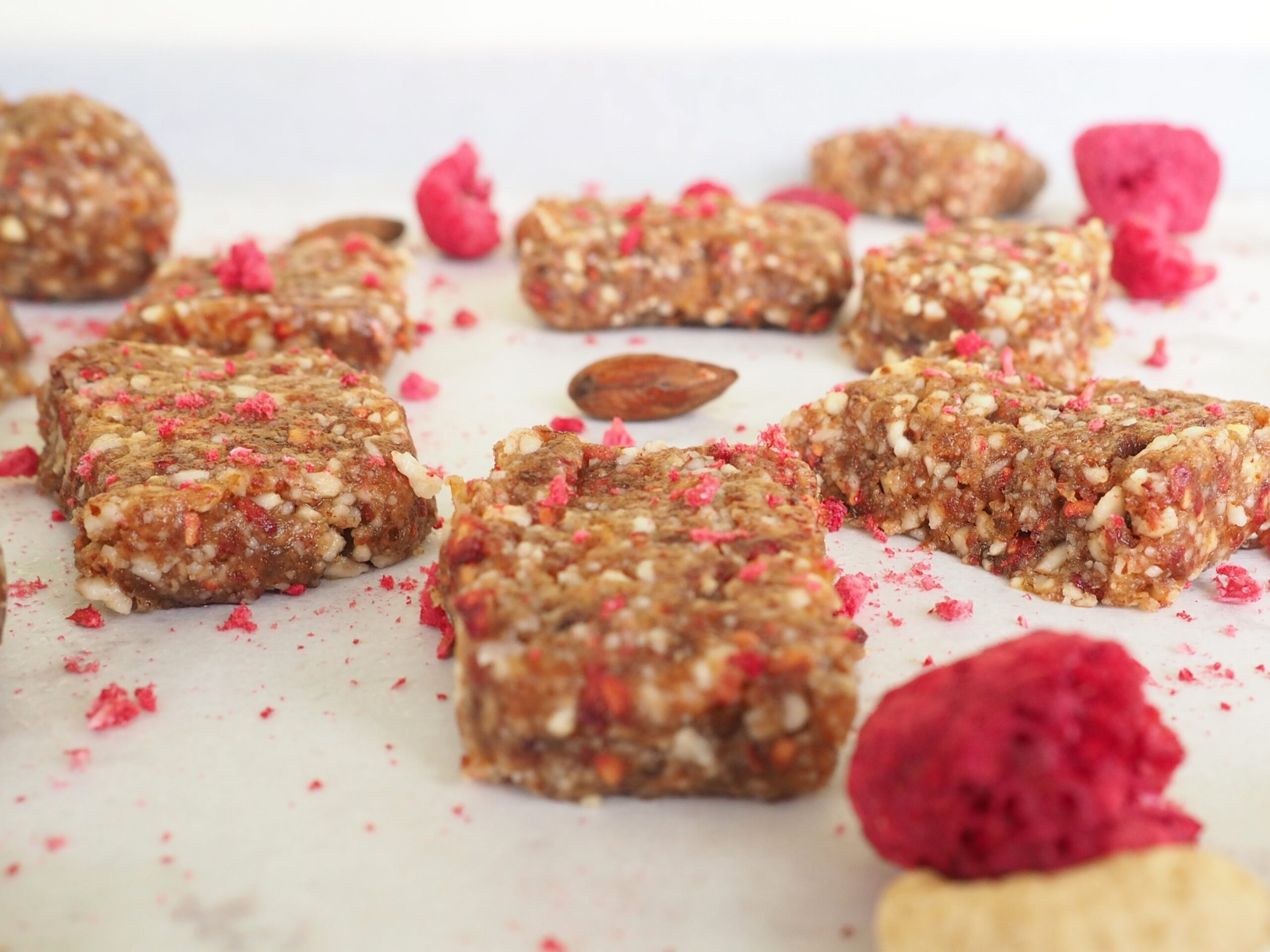These raspberry almond power bites make a perfect snack, coffee pairing, or athletic fuel. No-bake, gluten-free, vegan, and kid-approved. From halsanutrition.com