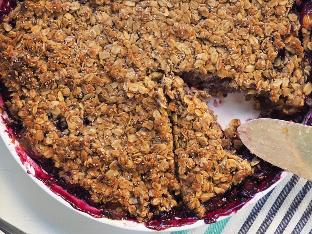 This blueberry peach breakfast crisp is packed with delicious flavor and wholesome goodness, making it the perfect addition to your breakfast! Yes, why not make a crisp that is just for breakfast! It's sure to brighten up your weekday morning and it's ample size means leftovers the next day. Vegan and gluten-free, it's also easy to make nut-free. So get some peaches and wild blueberries and go! 