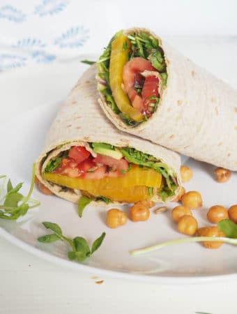 This Roasted Beet, Avocado, and Tomato Wrap is the perfect summer sandwich. Like having a salad in a wrap, it's packed with deliciousness in every bite. With microgreens, toasted sesame seeds, and fresh lemon juice, this is no ordinary wrap. Keep it vegan or add a little feta cheese if you like. Serve with roasted chickpeas and fresh summer berries. From halsanutrition.com.
