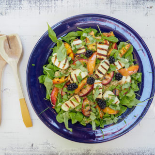 This stone fruit salad with quinoa, arugula, and halloumi is perfect for summer grill nights. Enjoy as a side salad or top with cannellini beans or grilled chicken for a festive dinner salad. Vegetarian & gluten-free. From halsanutrition.com