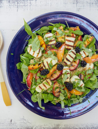 This stone fruit salad with quinoa, arugula, and halloumi is perfect for summer grill nights. Enjoy as a side salad or top with cannellini beans or grilled chicken for a festive dinner salad. Vegetarian & gluten-free. From halsanutrition.com